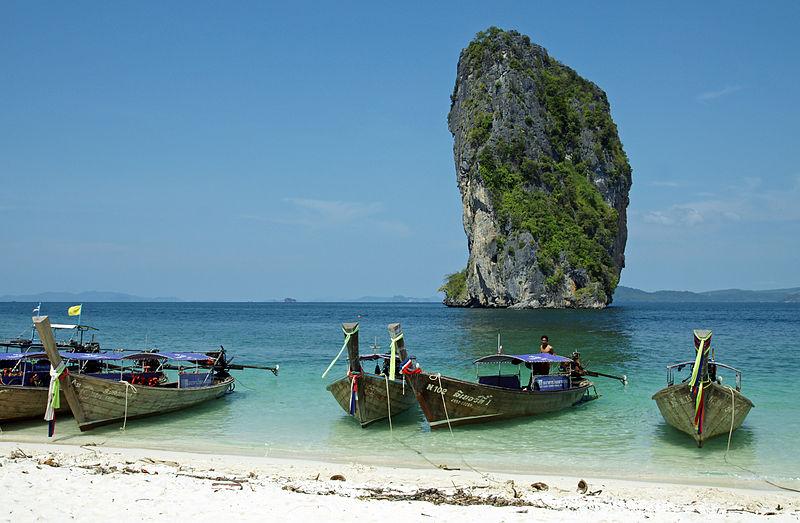 The beach of Poda island with long-tail boats